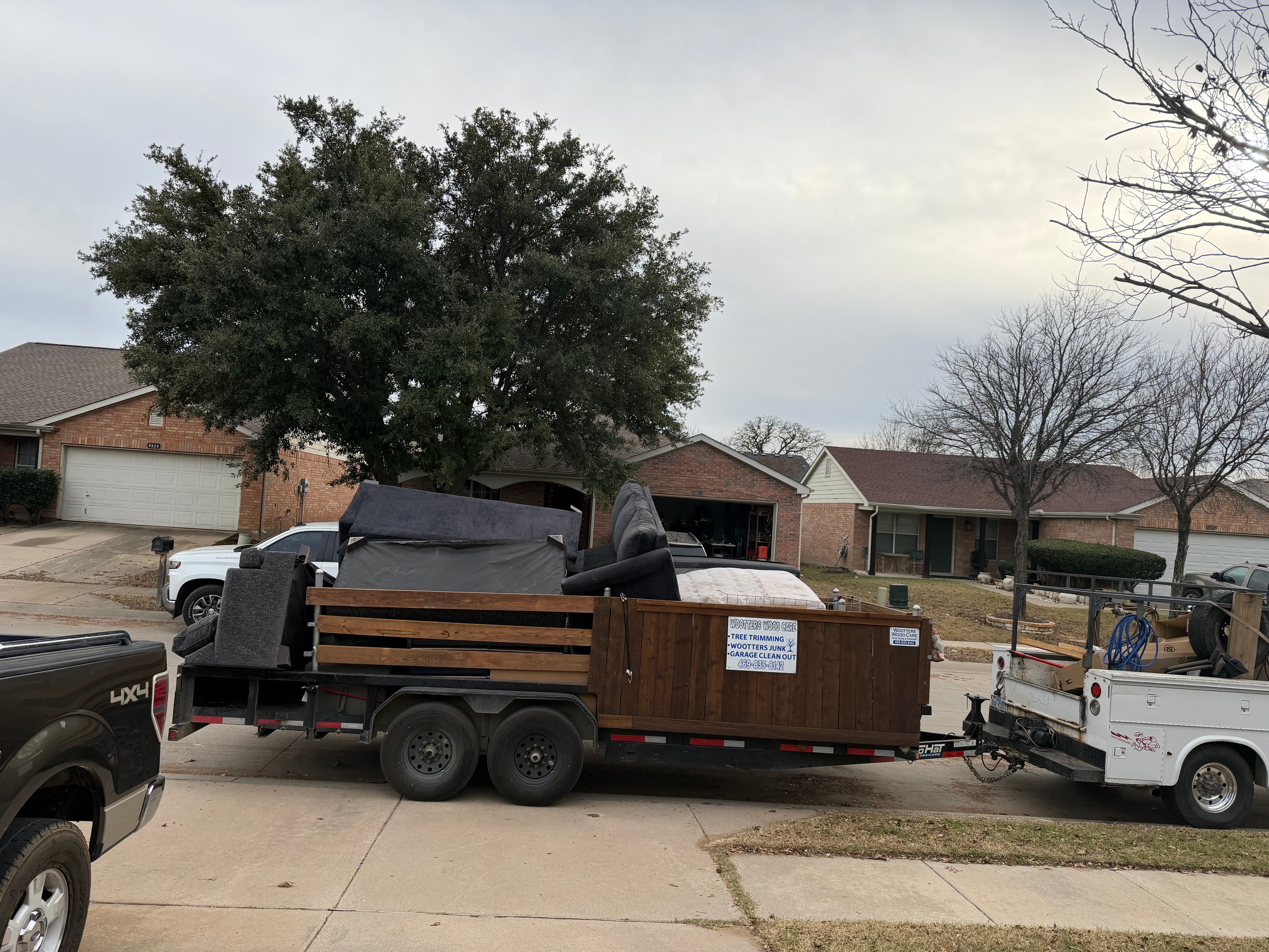 Workers hauling furniture and junk